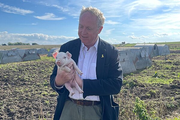 Brian holding a piglet