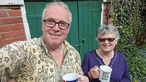 Brian and Pat holding mugs